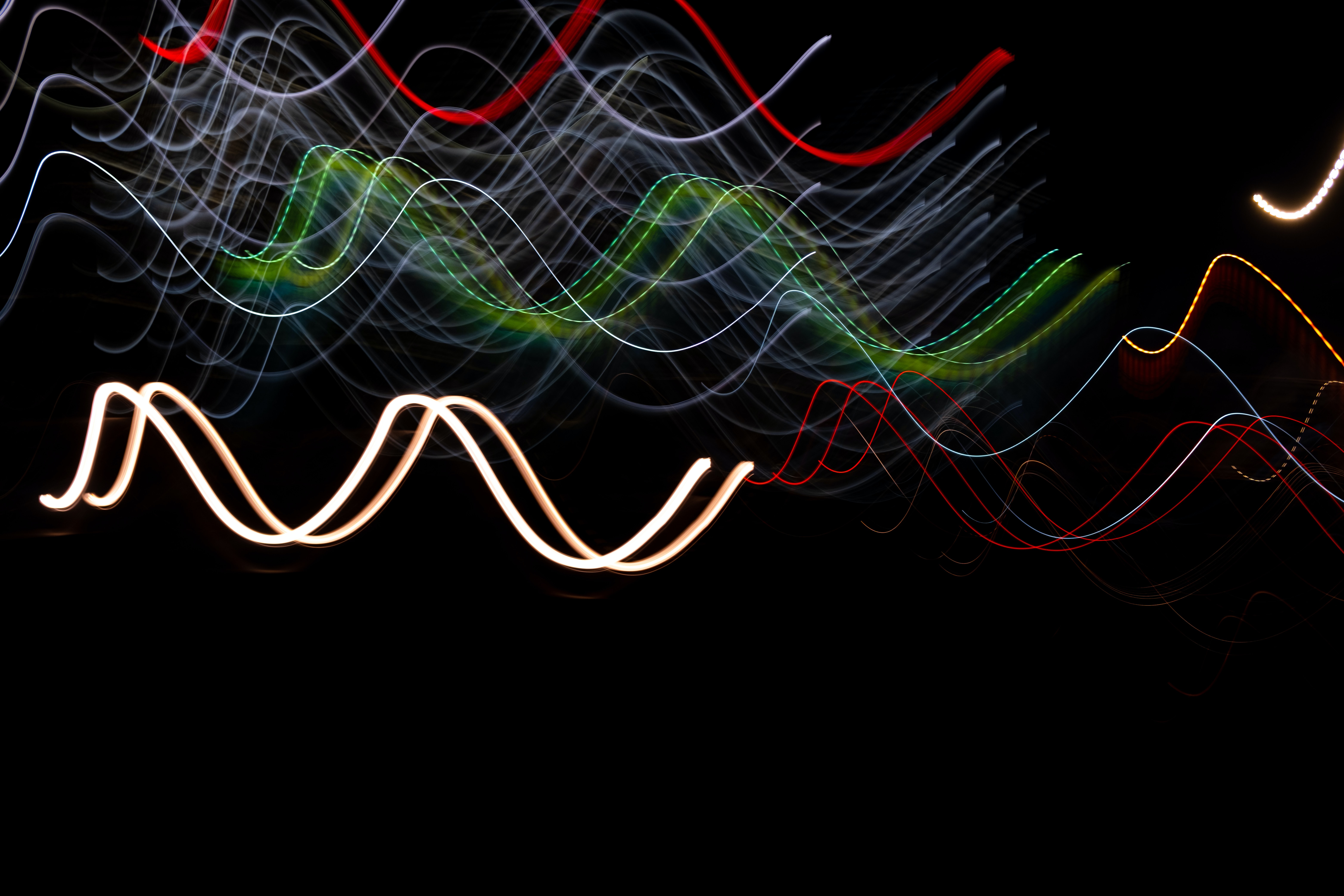 A series of wavy lines on a black background